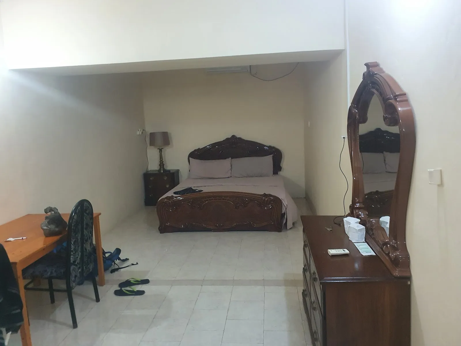 Deluxe double room with king size bed, dressing table and desk