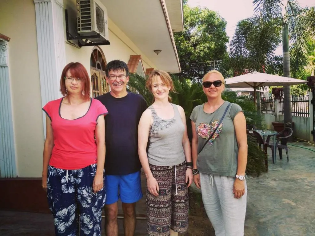Group of happy guests in the garden