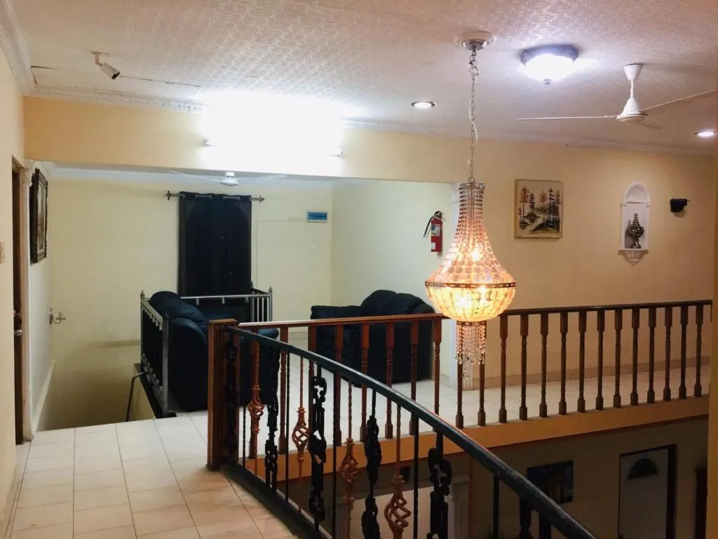 Mezzanine lounge with chandelier overlooking the hall