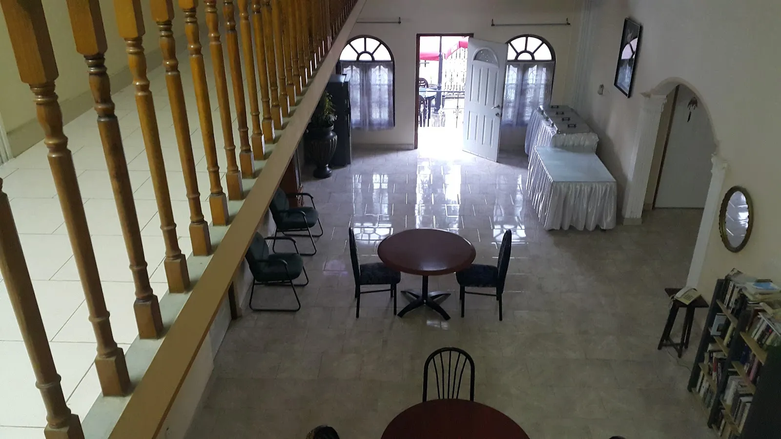 Upper floor function space with seating and wooden staircase